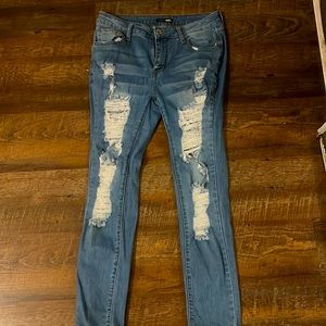 These are mid-rise jeans in the color blue.